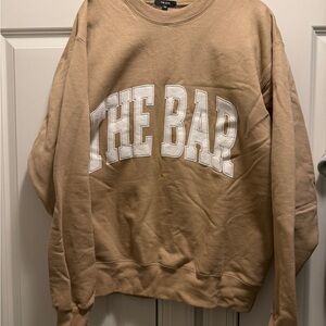Tan Sweatshirt with White Lettering